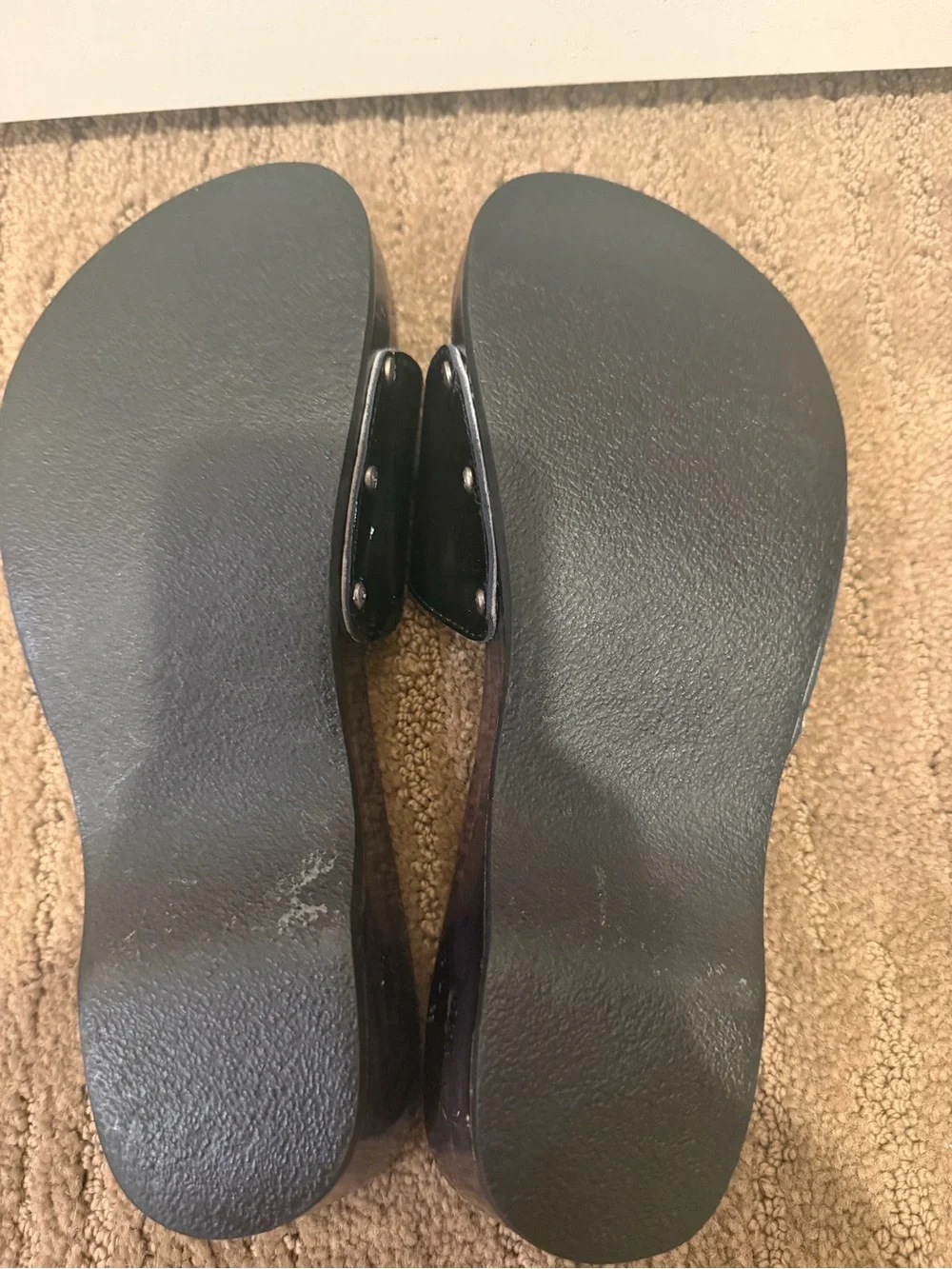 CHANEL Black Patent Leather Slide Mules with Silver Logo Plaque